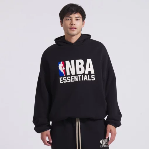 man is wearing black hoodie - nba x essentials collab hoodie