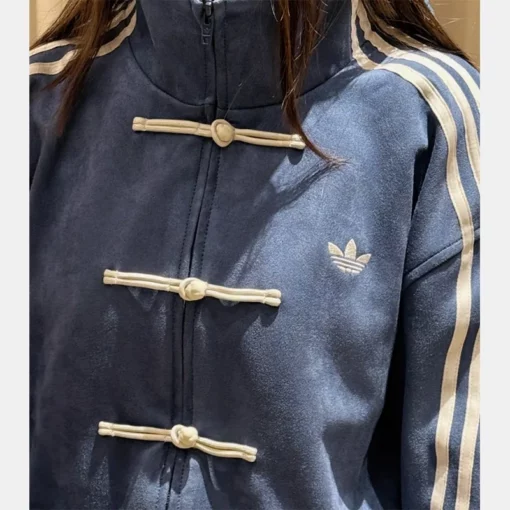 Unisex Adidas Tang jacket in suede leather, inspired by Chinese New Year festivities.