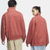 Adidas Tang red suede jacket with a sleek toggle closure for men and women.