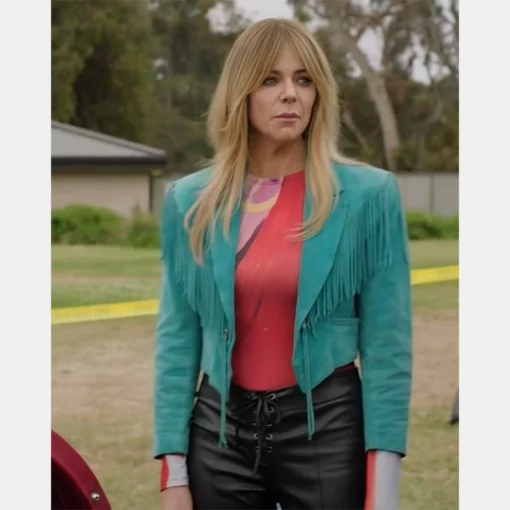 High Potential teal jacket with flowing fringe details, inspired by Morgan Gillory’s outfit.