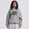 Cool grey hoodie from WNBA New York Liberty x Essentials—perfect for fans.