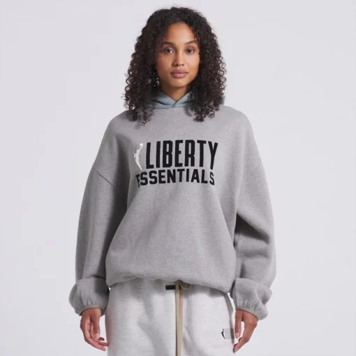 Cool grey hoodie from WNBA New York Liberty x Essentials—perfect for fans.