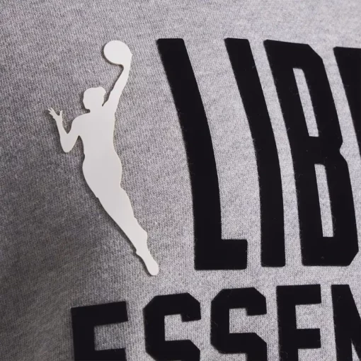 Stay cozy and sporty in the WNBA New York Liberty x Essentials Fleece Unisex hoodie.