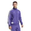 Unisex Adidas Terrace Icons tracksuit for Real Madrid fans in purple.
