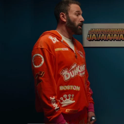 Cozy and stylish DunKings tracksuit featuring a scattered print of Dunkin’ Donuts logos, combining comfort with a bold aesthetic