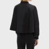 Back view of the Sarah Truong-inspired black bomber jacket with a smooth, modern design.