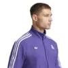 Real Madrid 24/25 purple Terrace Icons tracksuit with Adidas branding.
