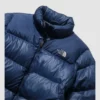 Down Blue Puffer Jacket with The North Face logo at the front