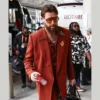Travis Kelce's retro-inspired rust-colored suit at Super Bowl LIX
