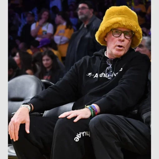 Unisex black fleece hoodie showcasing the Arthur Ashe signature logo, worn by Will Ferrell at an NBA Game