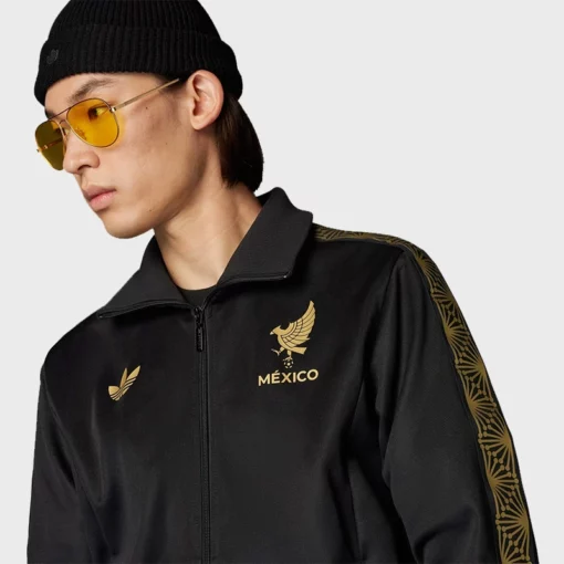 Mexico-inspired black track jacket featuring gold detailing and sporty appeal.