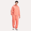 Fear of God Essentials hoodie and sweatpants in a vibrant coral shade.
