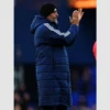 Nuno Espirito Santo’s signature blue puffer coat for a classic football look.