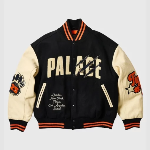 Black and Cream Palace varsity jacket with striped ribbed cuffs and a classic snap button closure.