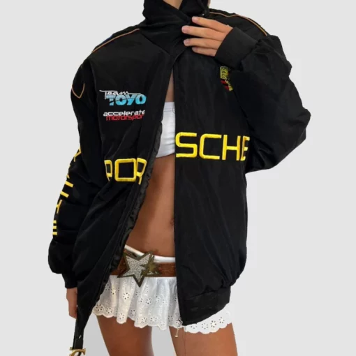 Sleek black Porsche F1 jacket with retro racing-inspired details.