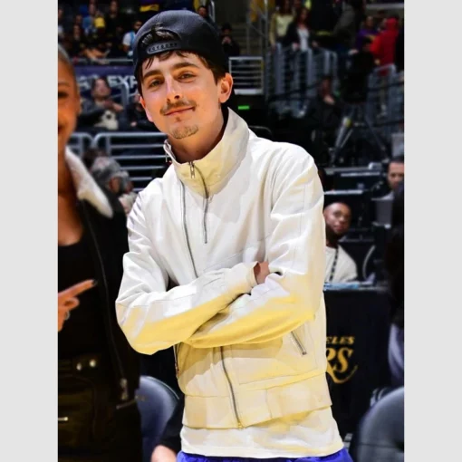 Knicks vs. Lakers game outfit highlight: Timothée Chalamet’s iconic white leather jacket.