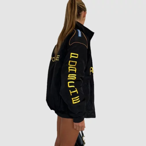 Black vintage Porsche racing F1 jacket with classic motorsport branding.