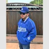 Retro-style blue dugout jacket featuring Dodgers logo by Mitchell & Ness.