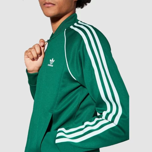 Classic green Adidas track jacket with signature 3-stripes.