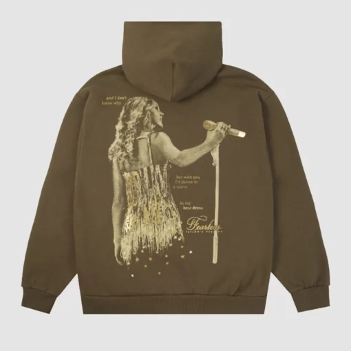 Brown pullover hoodie with "Dance in a Storm" quote from Taylor’s Version.