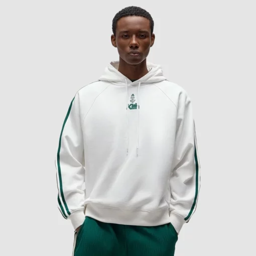 Adidas and Kith collaboration hoodie in white sports style.