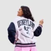 Pink Disneyland varsity jacket with Mickey Mouse design, unisex.