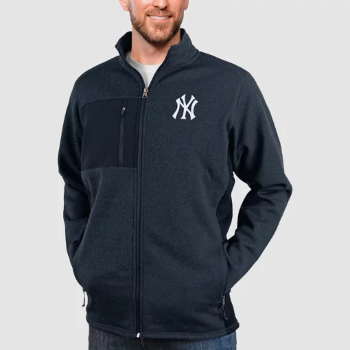 Heathered navy New York Yankees zip-up outerwear.