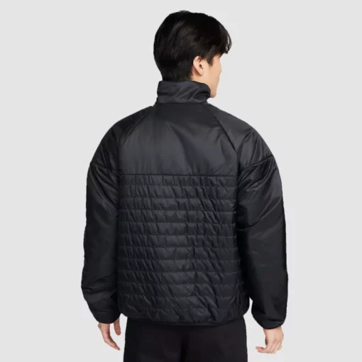 Black Nike Therma-FIT midweight puffer with hood.