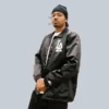 Front view of Dodgers black coaches jacket featuring embroidered team logo
